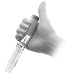 A hand vertically gripping a pen-shaped medical device with a cylindrical body and a transparent lower section
