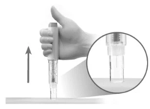 A hand holding a cylindrical medical device with an arrow pointing upward