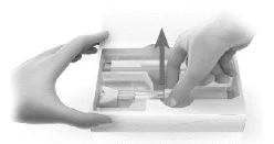 Two hands removing a syringe from a rectangular container with an upward motion
