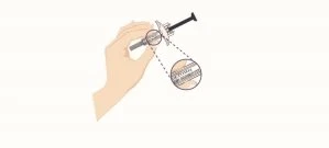 A hand holding a syringe with a circular magnifier showing details of the tip of the needle