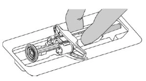 Two hands holding and manipulating a cylindrical medical device