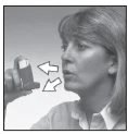 A woman holds an inhaler near her mouth, with two white arrows indicating the direction of medication flow toward the