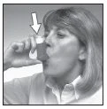 A woman in profile drinks from a small container, with a white arrow pointing to the rim of the container