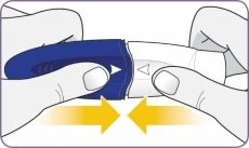 Two hands holding a blue and white medical device and bringing it together toward the center following the direction of the yellow arrows
