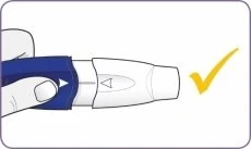 One hand holding a white and blue medical device with a yellow checkmark indicating the correct procedure to follow