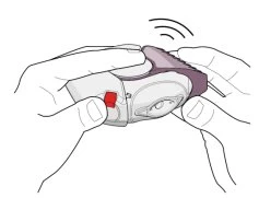 Due mani tengono un dispositivo medico bianco con un pulsante rosso e un indicatore di pressione superiore che emette un segnale acustico