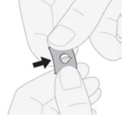 Two hands holding and opening a small square pouch with a central hole indicated by a lateral black arrow
