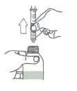 Line drawing showing a hand lifting a syringe with needle upward
