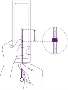 Diagram showing two hands holding a thin medical device with an enlargement highlighting the numbered graduated scale