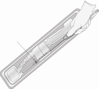 A gloved hand holding a syringe with a thin needle at the