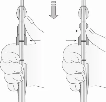 Diagram showing two hands gripping a cylindrical medical device with arrows indicating downward and lateral movement