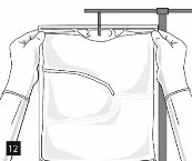Two hands holding a garment hanging on a horizontal support to show the position of a pocket on the chest with the number 12 at the bottom