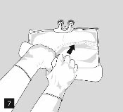 Two hands with white gloves holding and opening a medicine package with a black arrow indicating the top side of the container