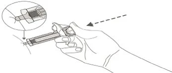 A hand holding a syringe ready for