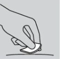 A hand holds a small rectangular adhesive patch and is applying it onto a light-colored curved surface