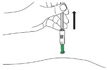 A hand holding a syringe with the