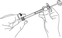 Two hands holding a prefilled syringe while a curved arrow indicates rotational movement to unscrew or attach a component