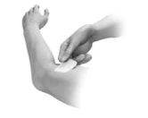 A hand applying an adhesive patch to the upper arm of a bent person