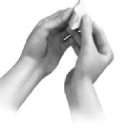 Two hands holding and manipulating a small, thin medical device on a neutral white background