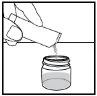A hand pours powder contents from a glass vial into