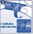 Dettaglio di una mano che ruota la ghiera di una penna per iniezione con una freccia blu e un ingrandimento che mostra 2 unità selezionate