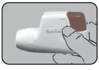 A hand holding a white medical device with a brown upper part for left