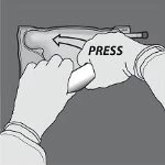 Two hands gripping a medical device to apply it to the thigh with an arrow indicating the direction of downward pressure
