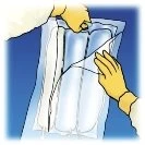 Two gloved hands carefully opening a transparent plastic package containing three cylindrical white vials against a blue background