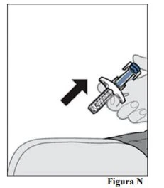 A hand holding a syringe with a