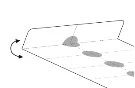 Schematic diagram showing a surface with four gray spots arranged diagonally and a curved arrow to the left