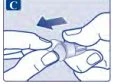 Two hands gripping and rotating a transparent medical device to the left, following the direction of a dark blue arrow