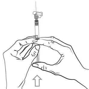 Two hands holding a syringe with needle pointing away from the body