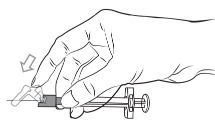 A hand holding a syringe with the