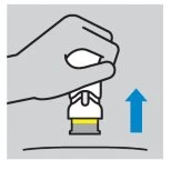 A hand holds a yellow and white medical device with a blue arrow pointing toward the