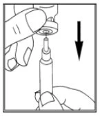 A hand holds a medical device while the
