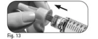 One hand rotates the upper part of an injection pen to attach the