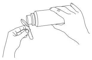 Two hands pouring the contents of a vial into a small glass test tube for drug preparation