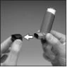 Two hands showing how to insert the bottom of a cylindrical inhaler into the square base indicated by a white arrow