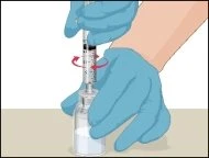 Hands with blue gloves rotating a syringe along