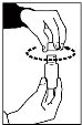 A hand holds the top part of a vial while the