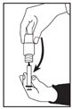 A hand holds a small bottle while the