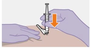 A gloved hand holding a syringe and pressing it downward onto the patient's skin indicated by a downward orange arrow