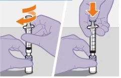 Two gloved hands manipulating a prefilled syringe with a curved orange arrow indicating rotation and a downward-pointing arrow