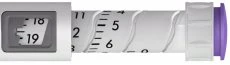 Close-up of a syringe with a numbered scale showing values 18 and 19 in a gray rectangular display on the left