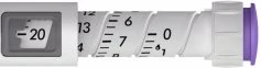 Detail of a medical device with a graduated scale numbered from 0 to 13 and a digital display showing the value -20