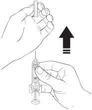 A hand lifting a cylindrical cap upward