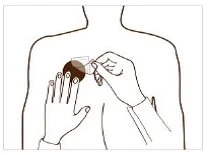 Line drawing of a person from behind with a hand pressing a dark circle onto the shoulder and the