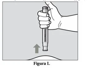 A hand holds vertically an injection pen above the skin of the injection site