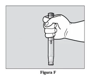 A hand holds vertically a medical injection pen with fingers wrapped around the body of the device on a light gray background