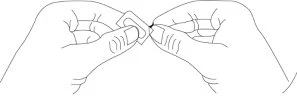 Two hands holding and separating with fingers a small white rectangular medical device with a central hole